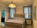 Spacious bedroom with a large bed and plenty of natural light at 3306 Sagebrush St, Harmony, FL 34773