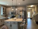 Modern kitchen with stainless steel appliances and an island at 3306 Sagebrush St, Harmony, FL 34773