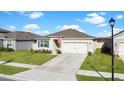 One story home with a two car garage and well maintained lawn at 5109 Barombi Bnd, Saint Cloud, FL 34772