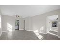 Open living area with tile floors and views into kitchen area at 907 Columbia St, Orlando, FL 32805