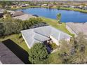 House with a screened patio, overlooking a lake at 940 Shorehaven Dr, Kissimmee, FL 34759