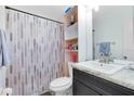 Clean bathroom with a shower/tub combo, vanity, and granite countertop at 116 Candlewick Ct, Sanford, FL 32771