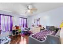 Small bedroom with a twin bed, dresser, and purple accents at 116 Candlewick Ct, Sanford, FL 32771