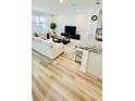 Bright living area with hardwood floors and open concept design at 11926 Sunsail Ave, Orlando, FL 32832