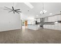Spacious kitchen with an island, stainless steel appliances, and stylish white cabinetry at 1804 Westminster Trl, Clermont, FL 34714