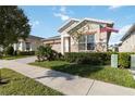 One-story home with American flag and well-manicured lawn at 2756 Greenlands St, Saint Cloud, FL 34772