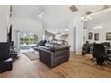 Open living room with a view of the pool and kitchen at 2835 Crane Trace Cir, Orlando, FL 32837