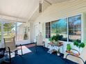 Bright and airy screened porch furnished with rocking chairs at 301 Evandee Ct, Kissimmee, FL 34758