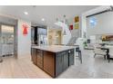 Open concept kitchen with large island and stainless steel appliances at 7211 Still Pond Ln, Windermere, FL 34786