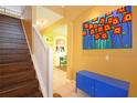 Dark wood staircase with white railing leading to upper level at 160 Hideaway Beach Ln, Kissimmee, FL 34746