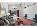 Living room with view of pool, couches, and coffee table at 201 Steamboat Blvd, Davenport, FL 33897