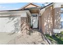 Front entrance with tiled flooring and potted plants at 2415 Black Powder Ln, Kissimmee, FL 34743