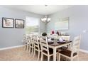 Dining room with large table and seating for ten at 2950 Buccaneer Palm Rd, Kissimmee, FL 34747