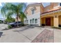 Two-story townhome with parking and palm trees at 4723 Terrasonesta Dr, Davenport, FL 33837