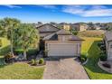 Property view showcasing house and neighborhood landscape at 580 Cantabria Dr, Davenport, FL 33837