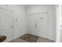 Bright entryway with double doors and a small table at 1201 Winding Willow Ct, Kissimmee, FL 34746