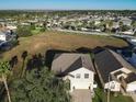 Aerial view showing the house and surrounding neighborhood at 124 Cassia Dr, Davenport, FL 33897