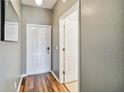 Light and bright entryway with wood-look floors and access to a bathroom at 2143 Calabria Ave, Davenport, FL 33897
