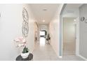 Bright and spacious entryway with tile flooring and neutral color palette at 233 Tiffany Ct, Kissimmee, FL 34758