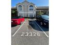 Condo parking lot with two cars parked at 2332 Prime Cir # B, Kissimmee, FL 34746