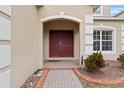 Elegant double door entry with brick walkway at 256 Lancaster Dr, Davenport, FL 33897