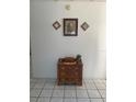 Entryway with antique wooden dresser and wall decor at 2681 Robin Ave, Kissimmee, FL 34744