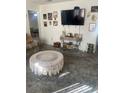 Living room featuring a large TV and comfy seating at 2681 Robin Ave, Kissimmee, FL 34744
