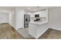 Modern kitchen with stainless steel appliances and an island at 4078 Malawi Trl, Saint Cloud, FL 34772