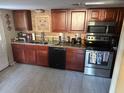 Updated kitchen featuring wood cabinets and stainless steel appliances at 4235 Edgewater Dr, Orlando, FL 32804