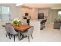 Modern kitchen with white cabinets, an island, and stainless steel appliances at 5052 Center Ct, St Cloud, FL 34772