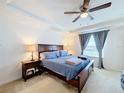 Bright bedroom with a king-size bed and large window at 524 Sardinia Cir, Davenport, FL 33837