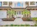 Elegant entryway with double doors and stone accents at 8162 Valhalla Ter, Reunion, FL 34747