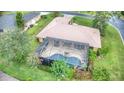 Home with a large screened pool and lanai at 26 Lake Diamond Ave, Ocala, FL 34472
