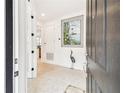 Bright entryway with tile floors and elegant wall art at 1813 Pelican Hill Way, Poinciana, FL 34759
