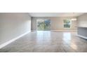 Open concept living area with tile flooring and lots of natural light at 22 Peterlee Ct, Kissimmee, FL 34758