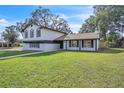 Charming two-story home featuring a large, well-maintained lawn at 3020 Rockingham Cir, Orlando, FL 32808