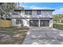 Attached two-car garage with concrete driveway and freshly painted exterior at 3020 Rockingham Cir, Orlando, FL 32808