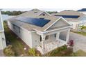 House showcasing solar panels and backyard at 3052 Ella Way, Saint Cloud, FL 34771