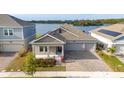 House with lake view and solar panels on roof at 3052 Ella Way, Saint Cloud, FL 34771