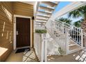 White railings and stairs leading to a condo building entrance at 308 Rum Run # B35/U308, Davenport, FL 33897