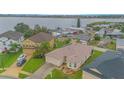House with a lake view in a residential neighborhood at 3643 Julius Estates Blvd, Winter Haven, FL 33881