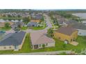 Community overview featuring houses near a lake at 3643 Julius Estates Blvd, Winter Haven, FL 33881