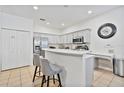 Modern kitchen with stainless steel appliances and island at 384 Orange Cosmos Blvd, Davenport, FL 33837