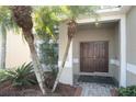 Double-door entry with landscaping and walkway at 4608 Cumbrian Lakes Dr, Kissimmee, FL 34746