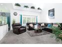 Spacious living room with sectional sofa and large windows at 4608 Cumbrian Lakes Dr, Kissimmee, FL 34746