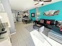 Open living space with kitchen, dining, and living room areas at 4724 Vero Beach Pl, Kissimmee, FL 34746