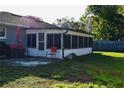 Cozy screened porch with patio furniture, offering a relaxing outdoor space at 500 16Th St, Saint Cloud, FL 34769