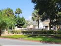 Tradewinds community entrance with lush landscaping at 1075 S Hiawassee Rd # 912, Orlando, FL 32835