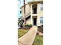 Condo building exterior with stairs and walkway at 1075 S Hiawassee Rd # 912, Orlando, FL 32835