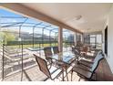 Covered patio overlooking a private pool and backyard at 1455 Rolling Fairway Dr, Davenport, FL 33896